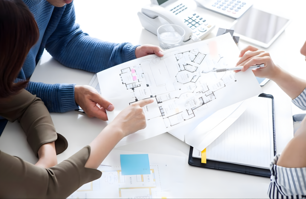 people analyzing building plans